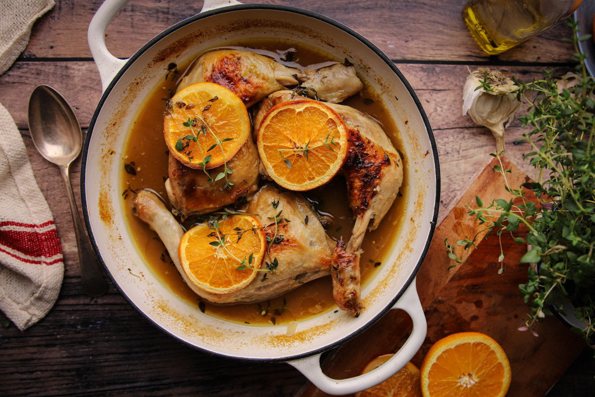 Orange and thyme chicken in casserole dish